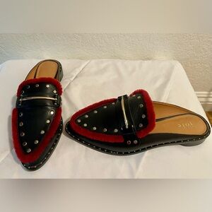 Amazing black pointed leather mules with red fuzzy accents and silver studs